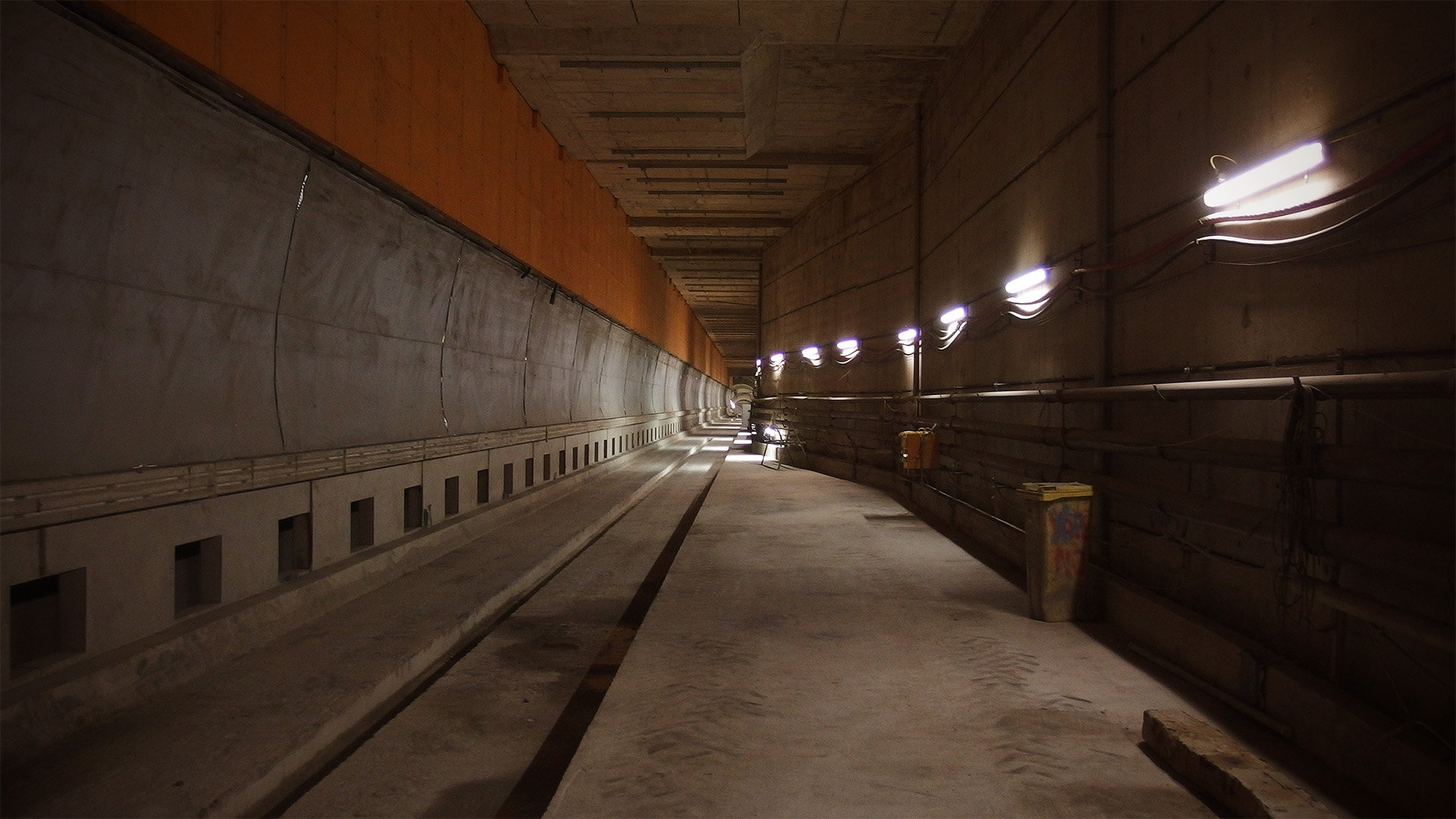 A view along an underground concrete platform