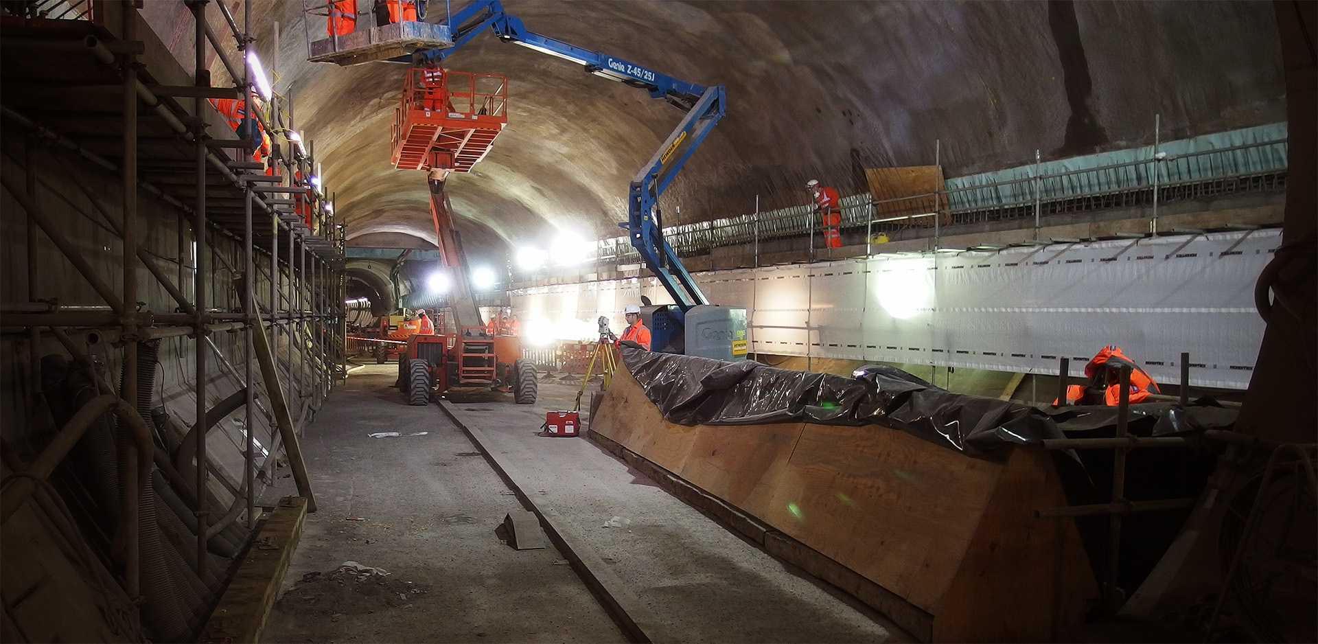 A huge cavern, busy with construction activity