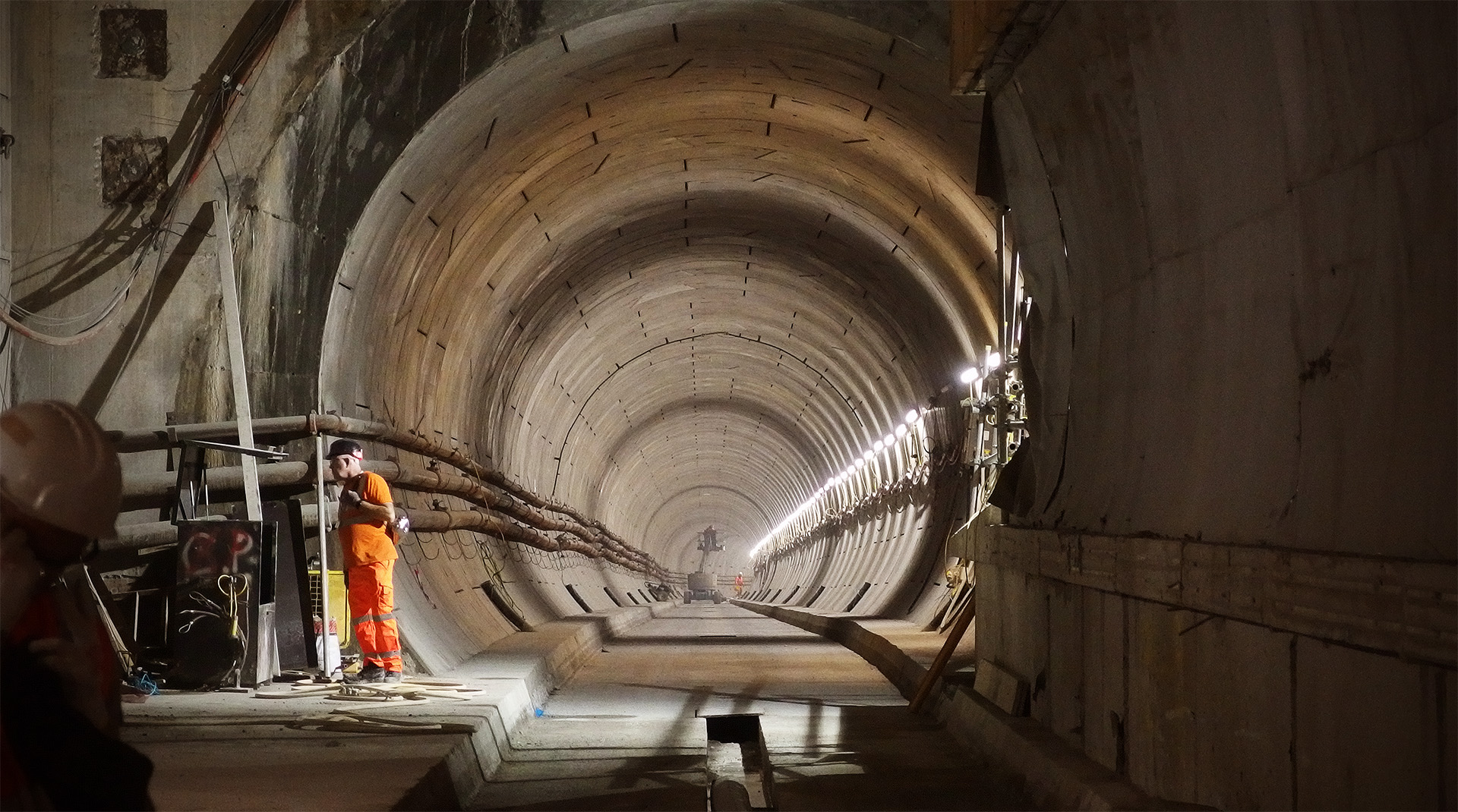 A tunnel slopes away out of an underground station